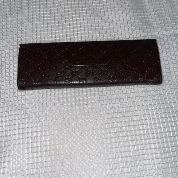 brown leather monogrammed foldable eyeglasses case from Gucci. - Picture 10 of 16
